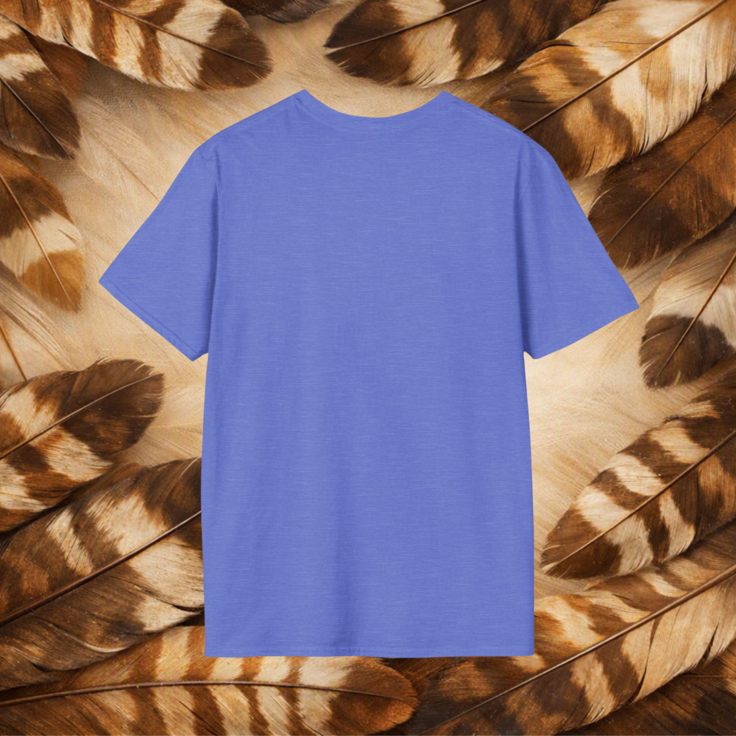 A heather royal t-shirt from the back laid flat on a background of tan and brown feathers.