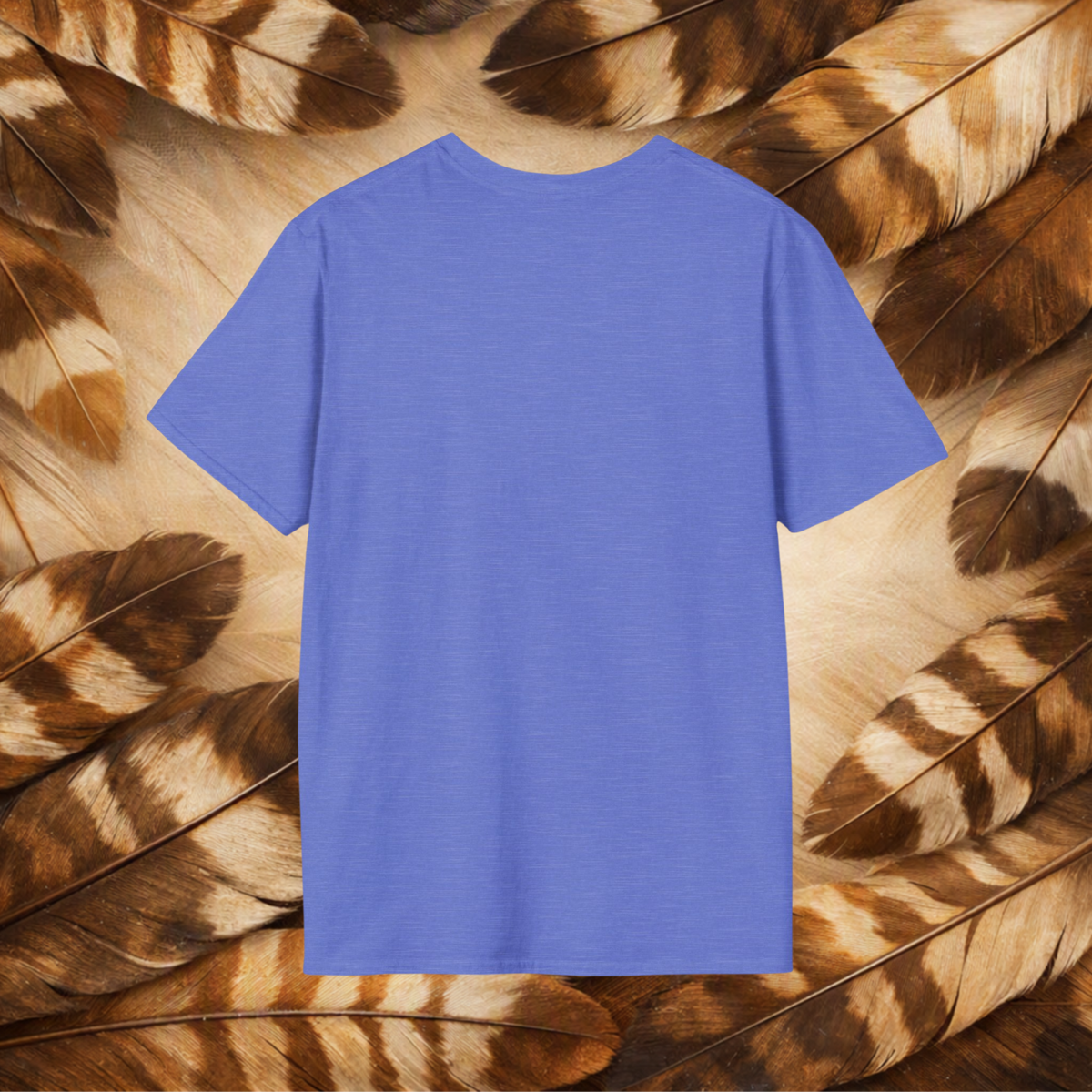 A heather royal t-shirt from the back laid flat on a background of tan and brown feathers.