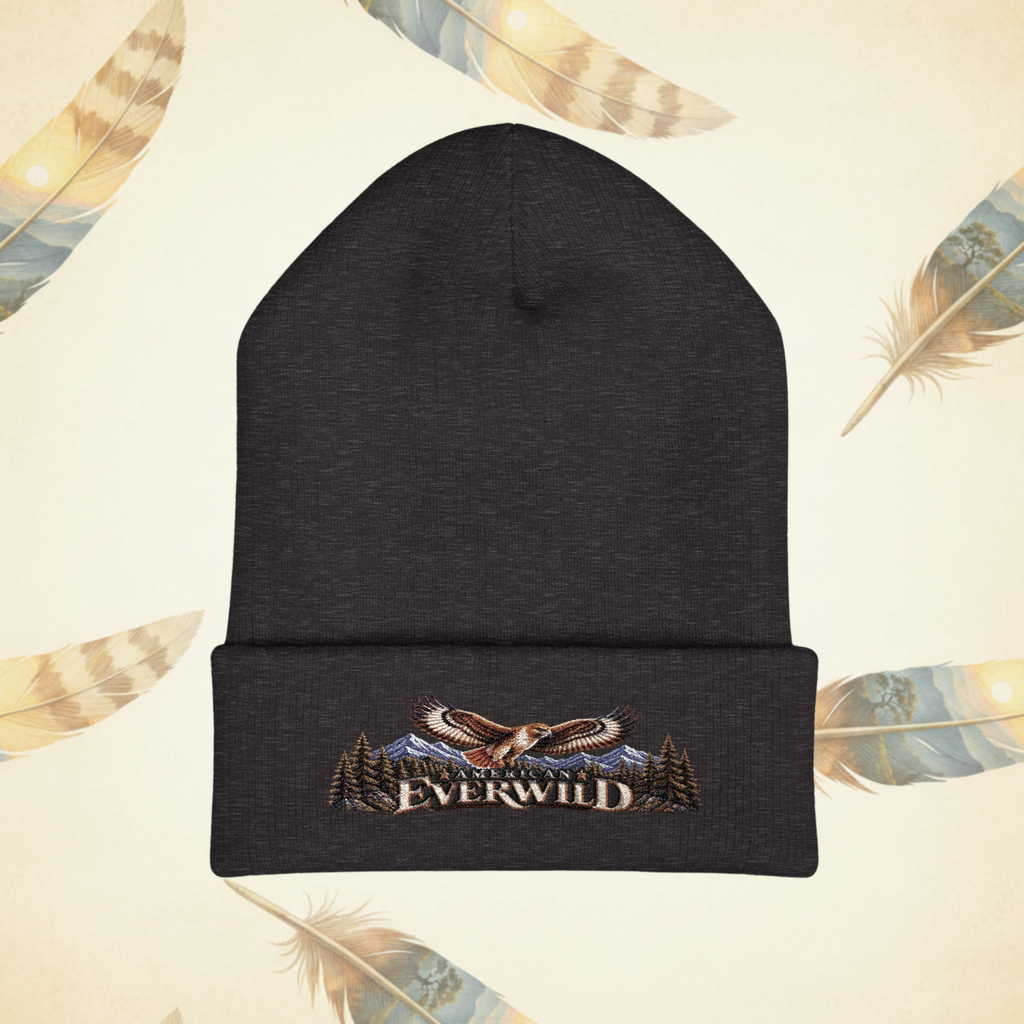 Dark heather gray American EverWild Beanie flat-lay on a cream-colored background of painted feathers.