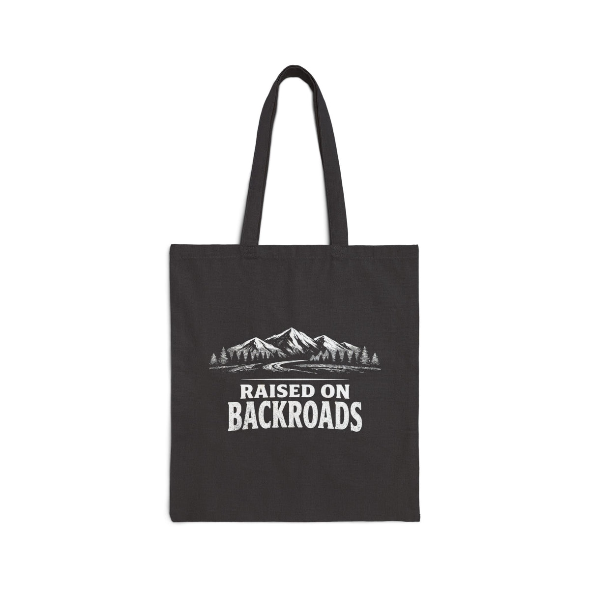 Black canvas tote bag with mountain scene and Raised on Backroads text, front view