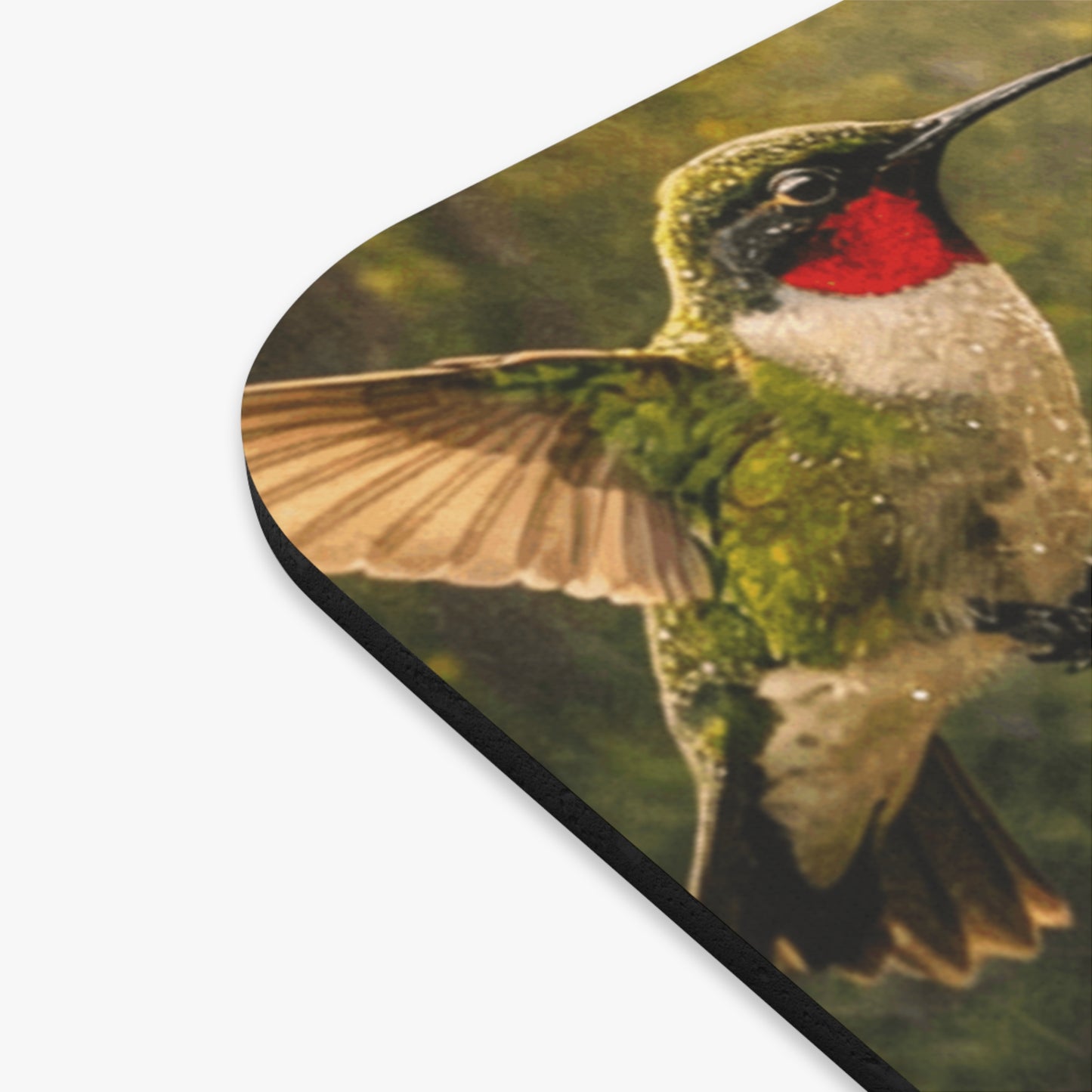 Rounded rectangular mouse pad corner with hummingbird detail and black trim edge