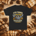Black t-shirt with a front view graphic with tools and text that reads'I Fix Things With Duct Tape and Misplaced Confidence, If it Holds It's Engineering', laid flat on a background of cream and brown feathers.