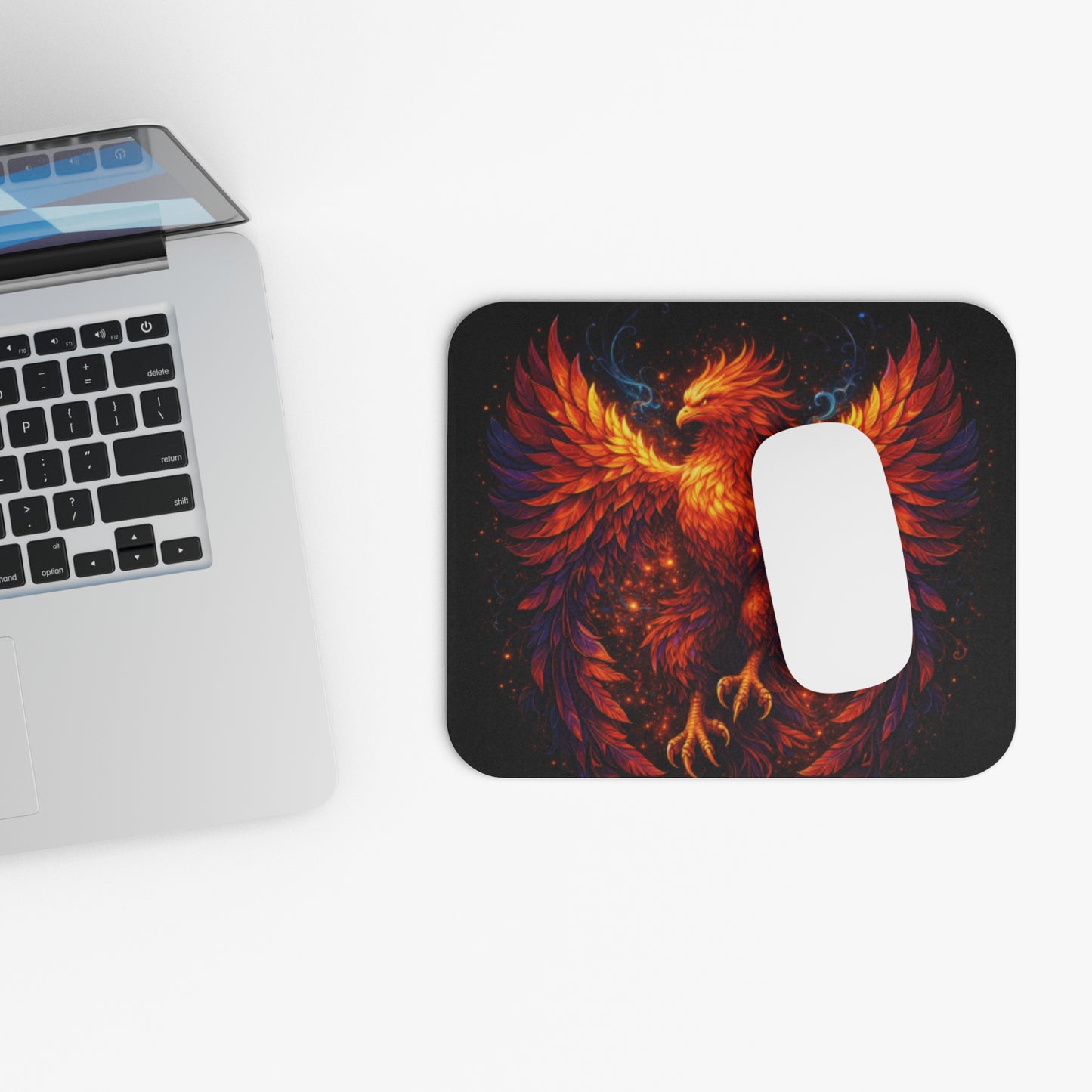 Rectangle mouse pad with phoenix wing design and white wireless mouse
