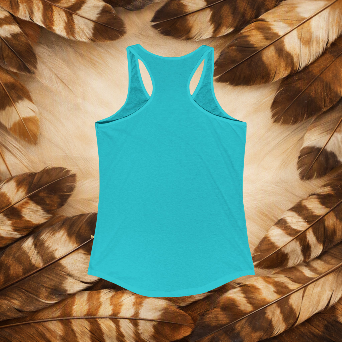 Solid Tahiti Blue backview of a flat lay racerback tank top on a background of brown and cream feathers.