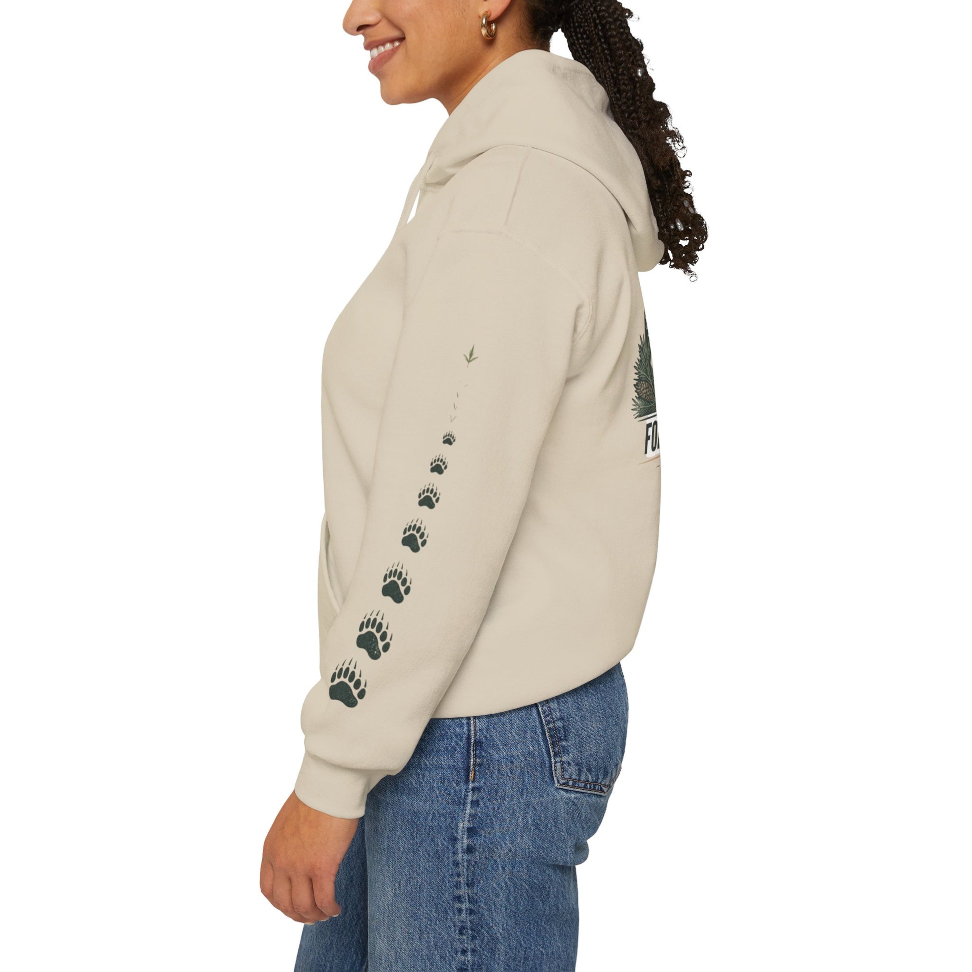 Beige pullover hoodie with paw-print sleeve graphic, side view