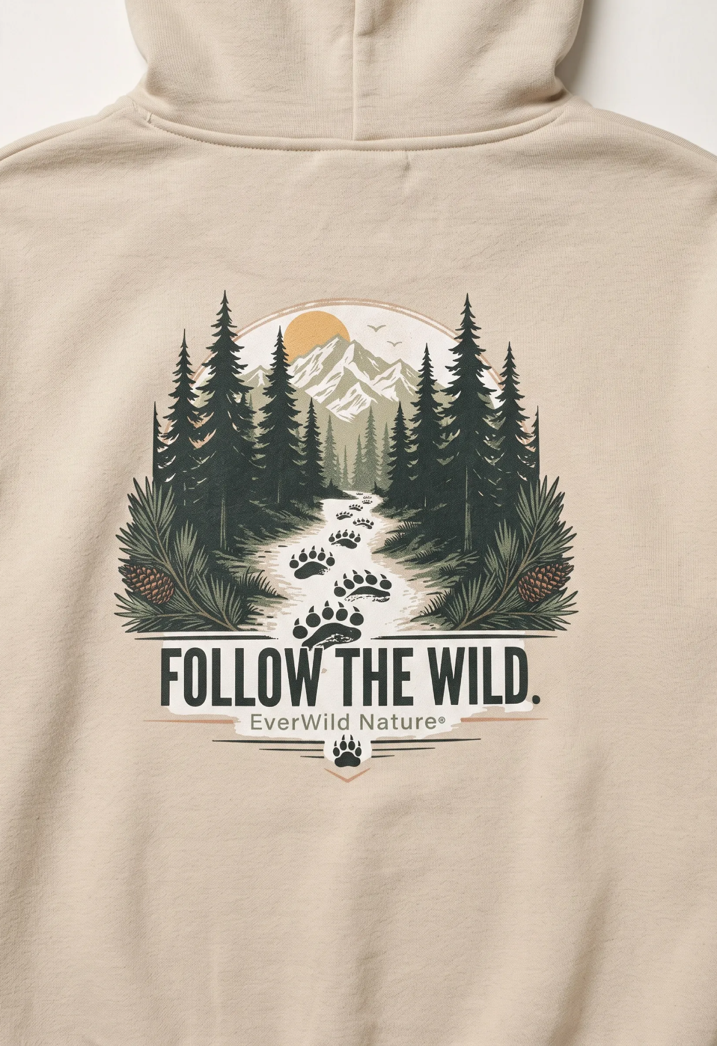 Beige pullover hoodie back panel with central forest scene and “Follow the Wild”