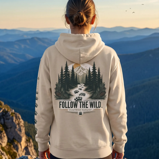 Beige pullover hoodie, back view, large forest graphic and “Follow the Wild” logo