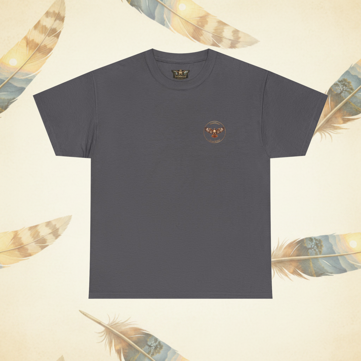 A dark gray crewneck t-shirt with a small circular hawk graphic  American EverWild logo on the left chest, displayed flat against a cream-colored background decorated with feather illustrations.