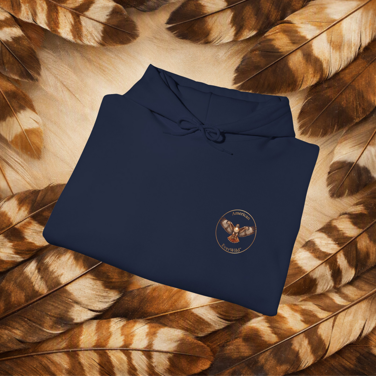 Navy Hoodie folded with close up of the front circular hawk emblem with text "American EverWild."