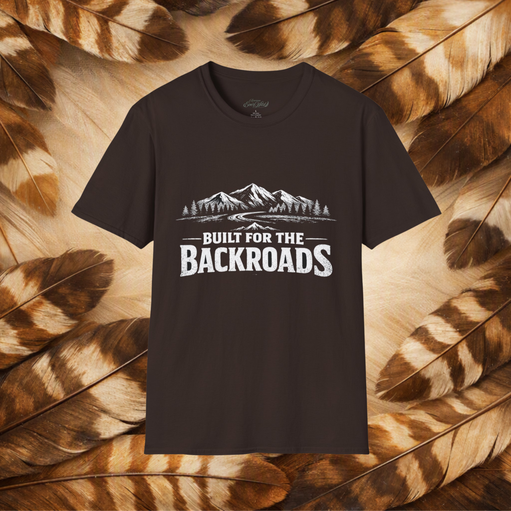A dark brown short-sleeve t-shirt with a white graphic print of mountains and the text 'BUILT FOR THE BACKROADS' displayed against a background of brown and beige feathers.