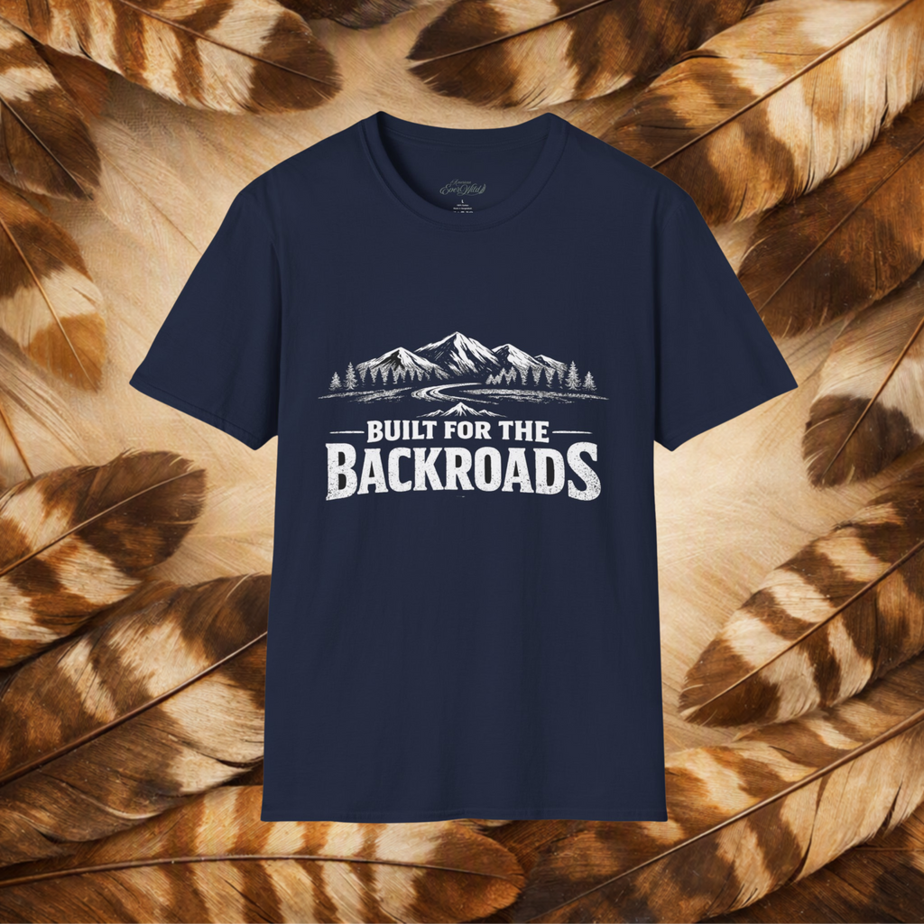 A navy blue short-sleeve t-shirt with a white graphic print of mountains and the text 'BUILT FOR THE BACKROADS' displayed against a background of brown and beige feathers.