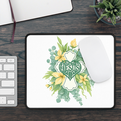 Square mouse pad with floral Jesus cross emblem on white background, black stitched edge