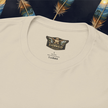 Close-up of a sand-colored crewneck t-shirt laid flat, showing the inner neck label with the brand 'American Everwild'.