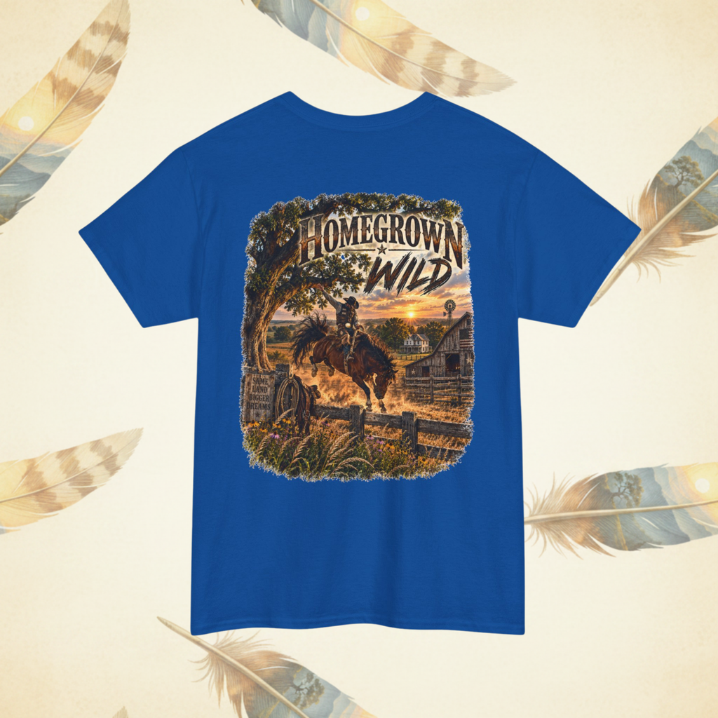 A royal blue short-sleeve t-shirt with a large western-themed graphic print on the back, featuring a cowboy riding a bucking horse in front of a sunset over a barn and fence. The graphic includes the text 'HOMEGROWN WILD'.