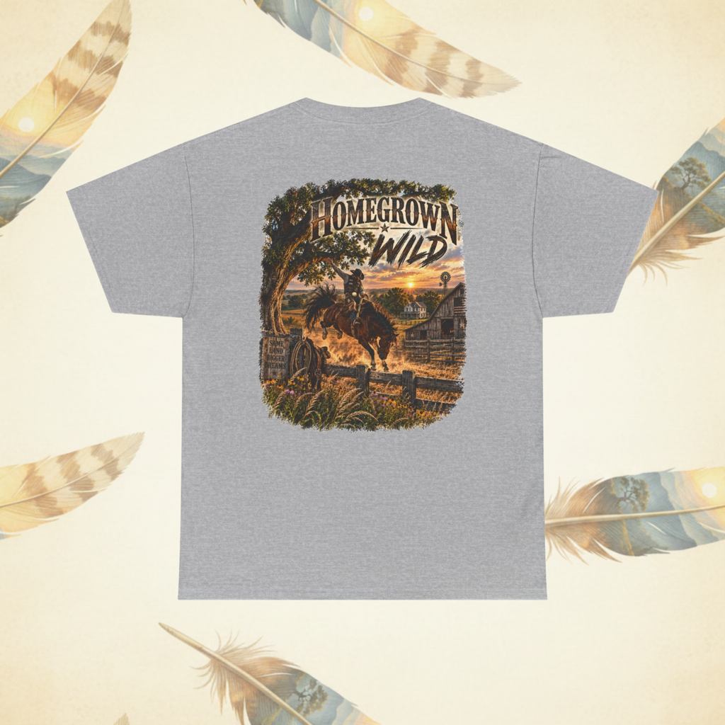A sport gray short-sleeve t-shirt shown from the back, featuring a large graphic print of a cowboy riding a bucking horse in front of a rustic barn at sunset. The graphic has the text 'HOMEGROWN WILD' arched over the scene.