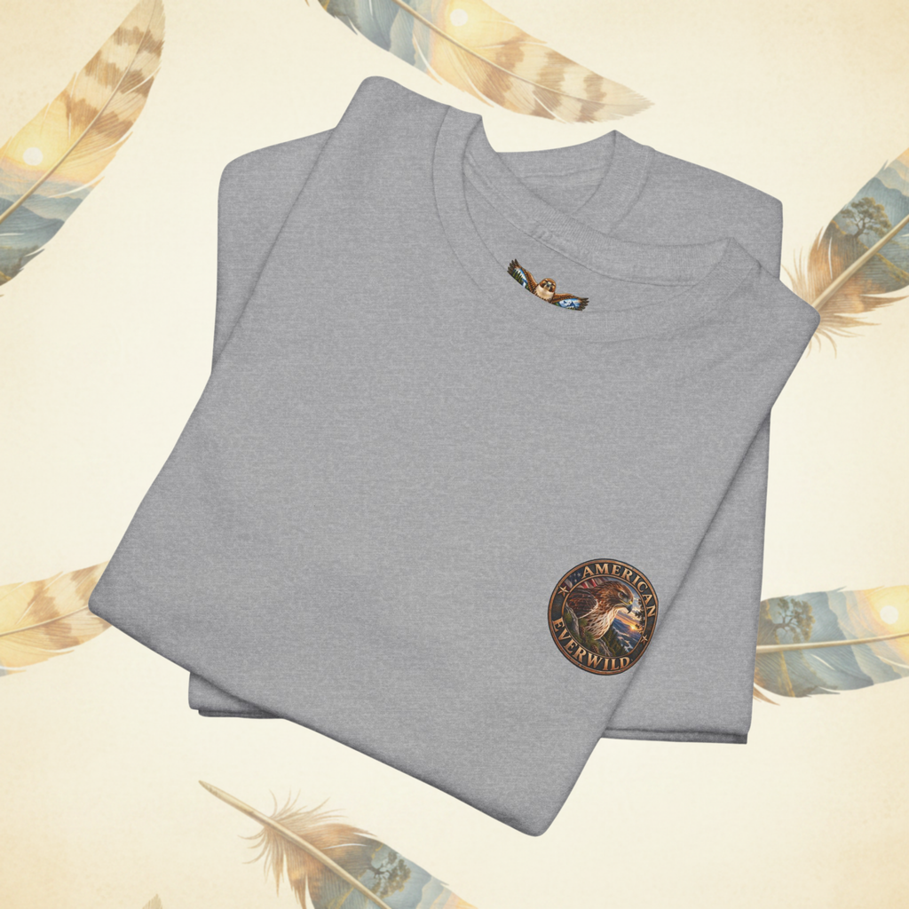 A folded sport gray t-shirt with a circular 'American EverWild' graphic logo on the left chest, displayed on a cream-colored background decorated with feathers.