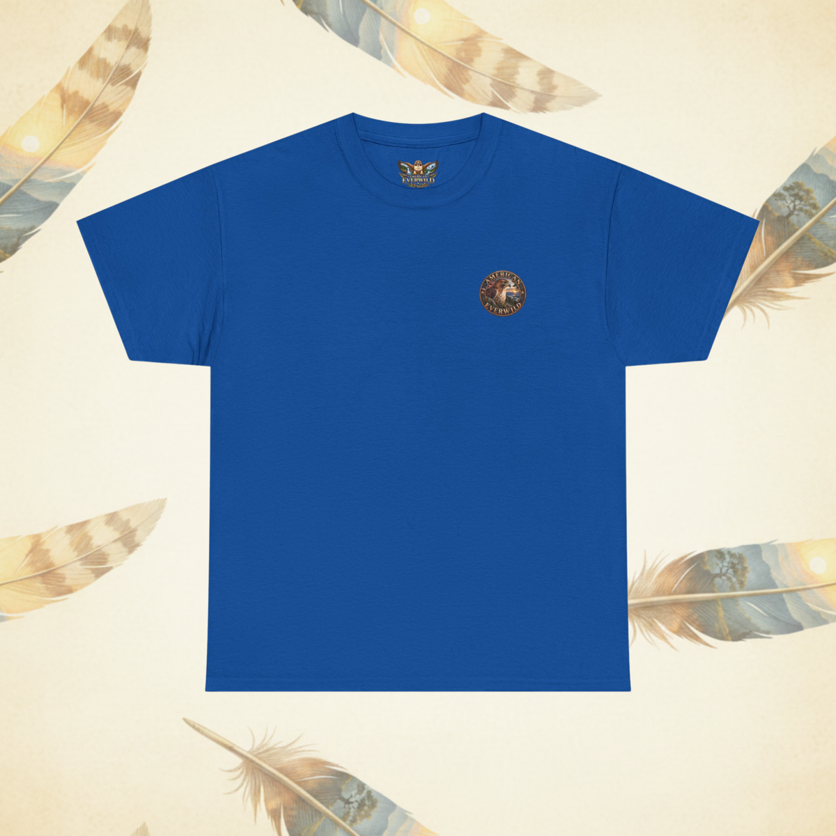 A royal blue short-sleeve crewneck t-shirt with a small circular ""American EverWild" logo printed on the left chest, displayed on a light beige background decorated with feather illustrations.