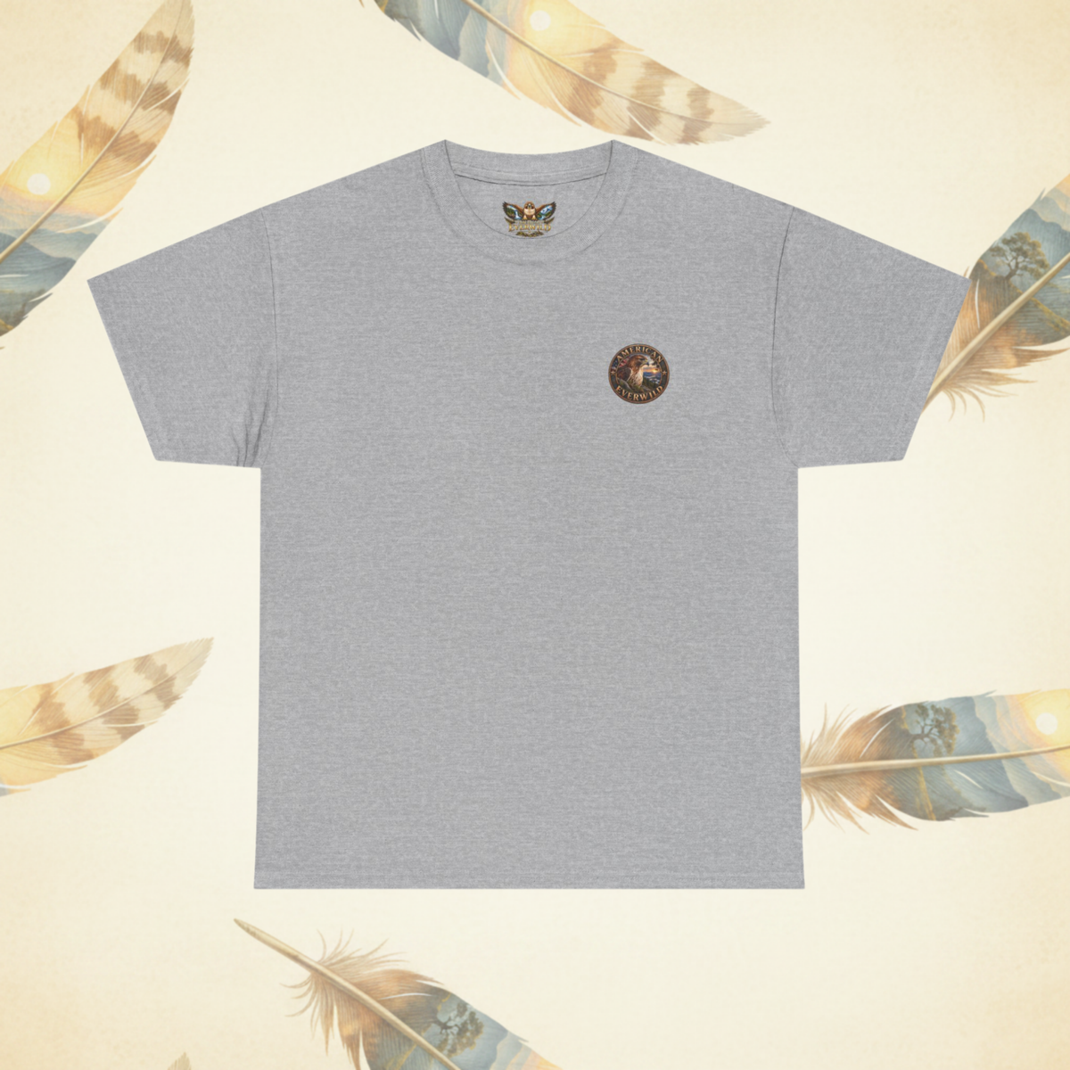 A heather gray short-sleeve t-shirt with a small circular "American EverWild" logo  on the left chest, displayed flat against a cream-colored background decorated with feathers.