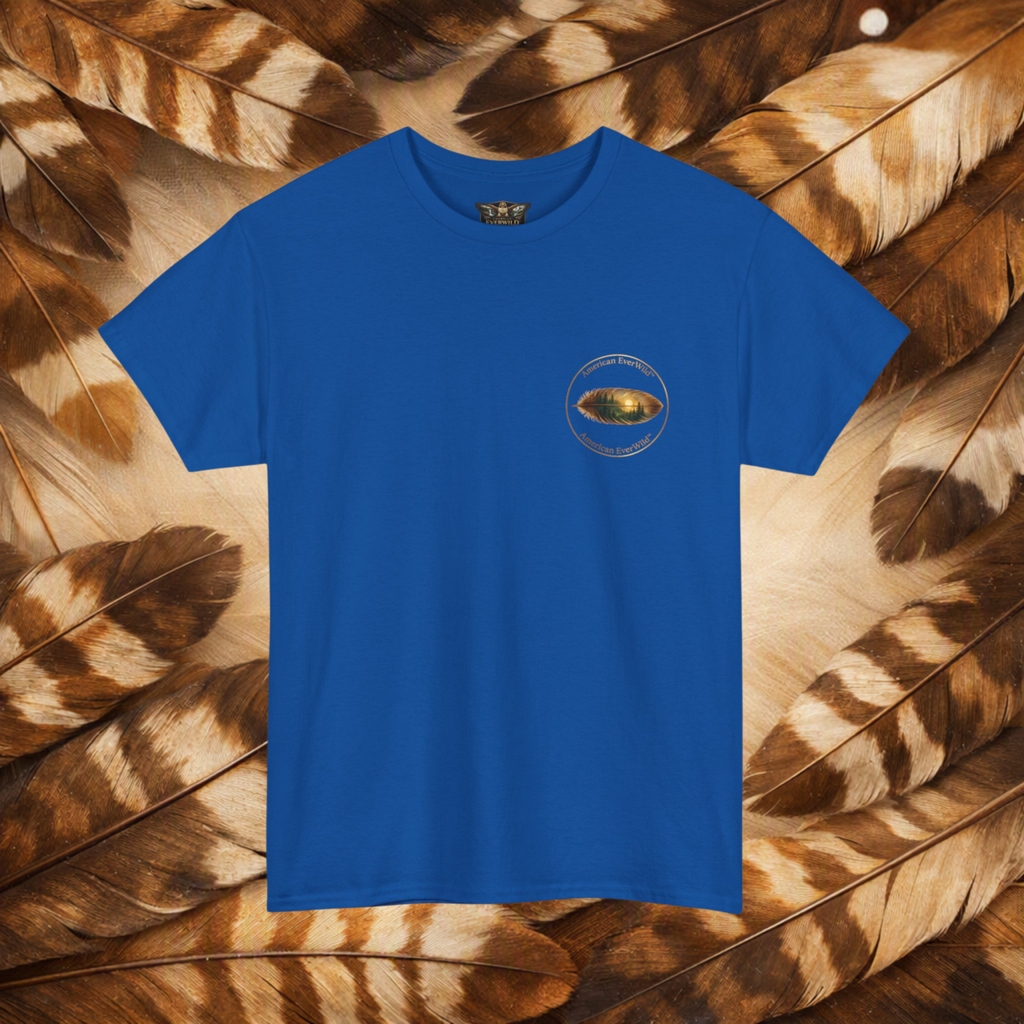 A royal blue short-sleeve crewneck t-shirt with a small circular American EverWild name top and bottom with a painted feather, displayed flat against a background of brown and beige feathers.