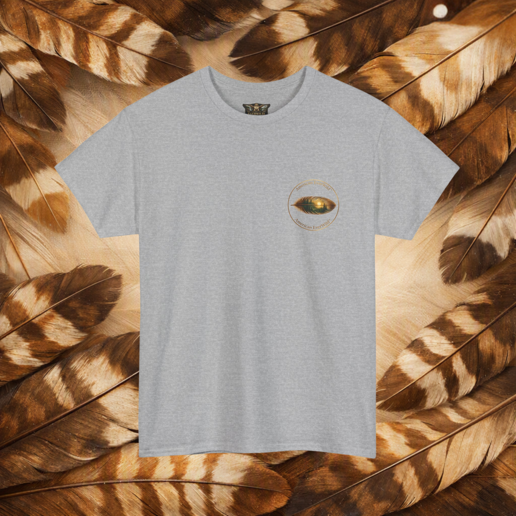 A sport gray short-sleeve crewneck t-shirt with a small circular American EverWild name top and bottom with a painted feather, displayed flat against a background of brown and beige feathers.