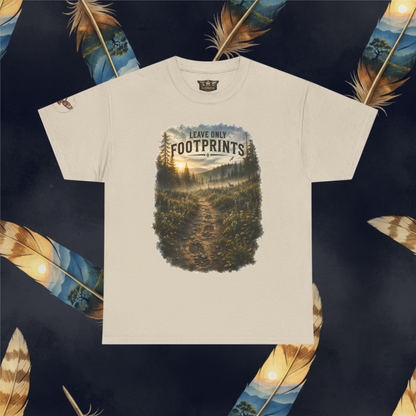 An sand color crewneck t-shirt featuring a graphic print of a forest trail with the text 'LEAVE ONLY FOOTPRINTS' on the chest, displayed flat against a dark background decorated with feathers.