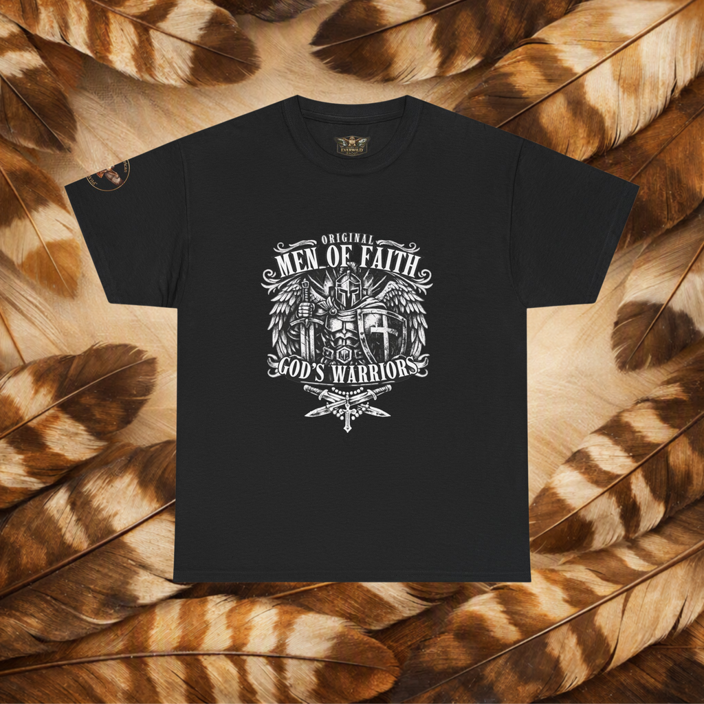 A black short-sleeve t-shirt with a white graphic print reading 'Original Men of Faith God's Warriors' and featuring a winged cross and dagger design, laid flat on a background of brown and tan feathers.