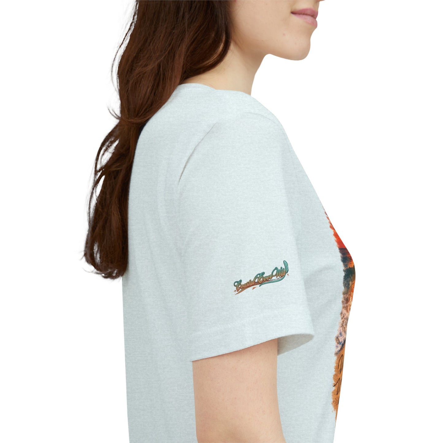 Light heather t-shirt side view with small sleeve logo and edge of chest graphic