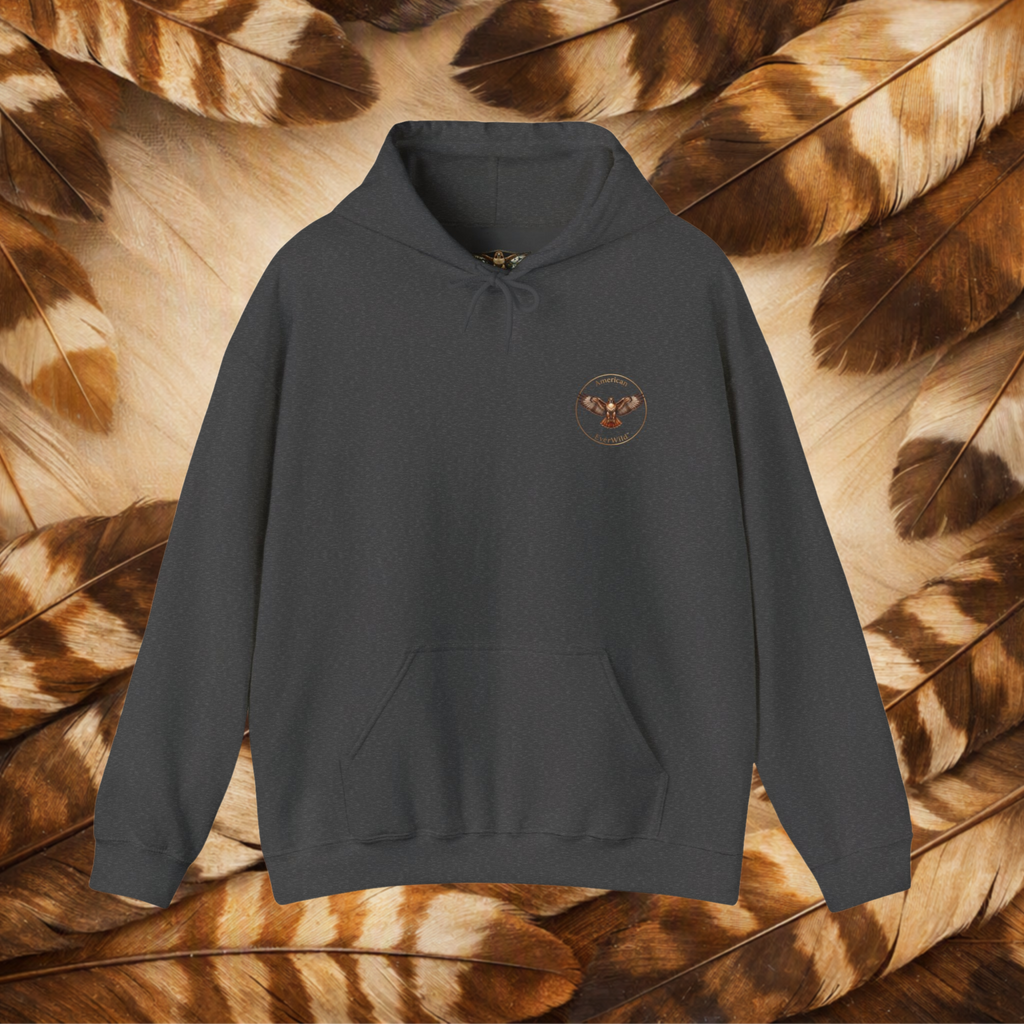 A dark charcoal gray pullover hoodie with a small circular embroidered logo for American EverWild on the left chest, displayed against a background of brown and beige feathers.