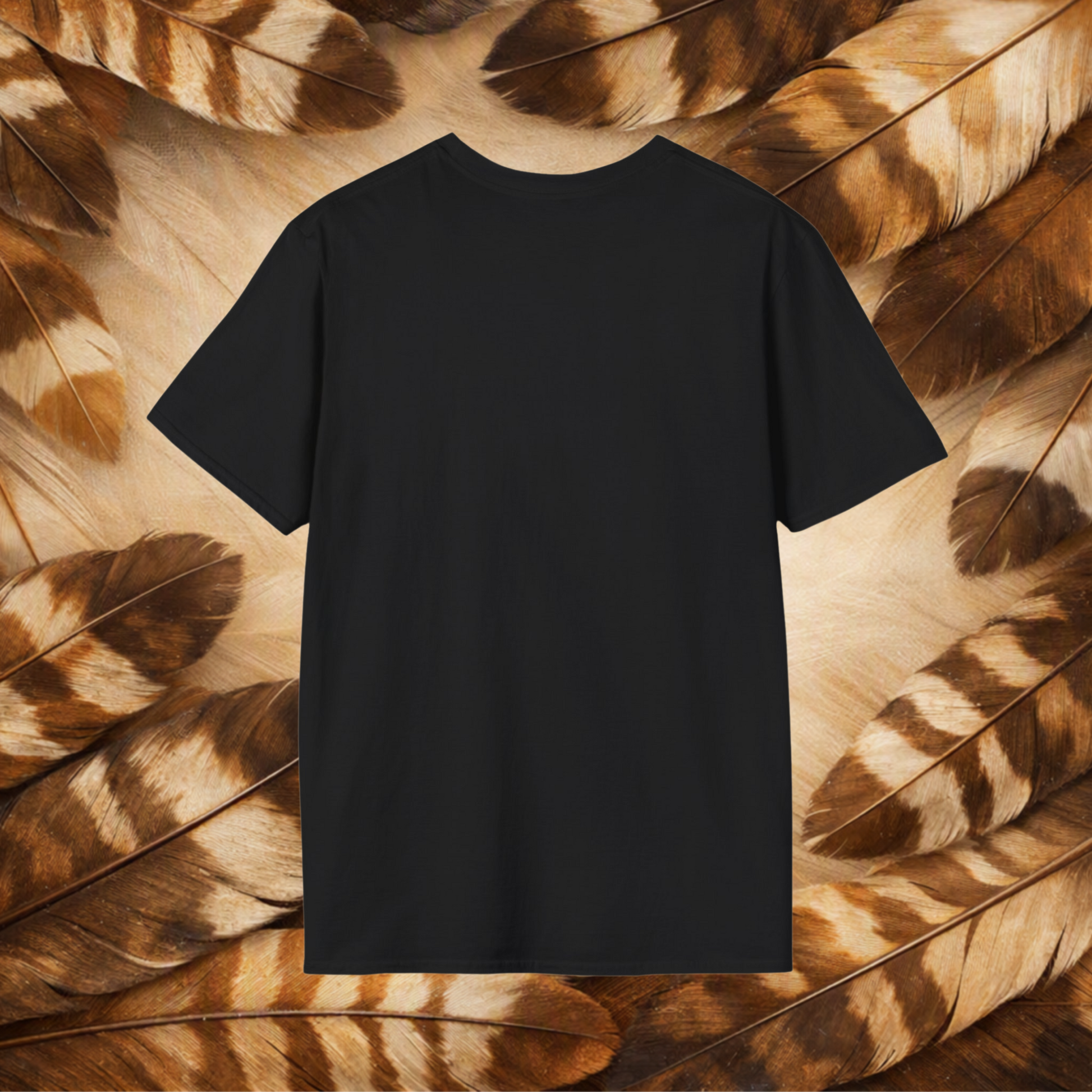 A plain black short-sleeve crewneck T-shirt centered against a background of brown and beige feathers.