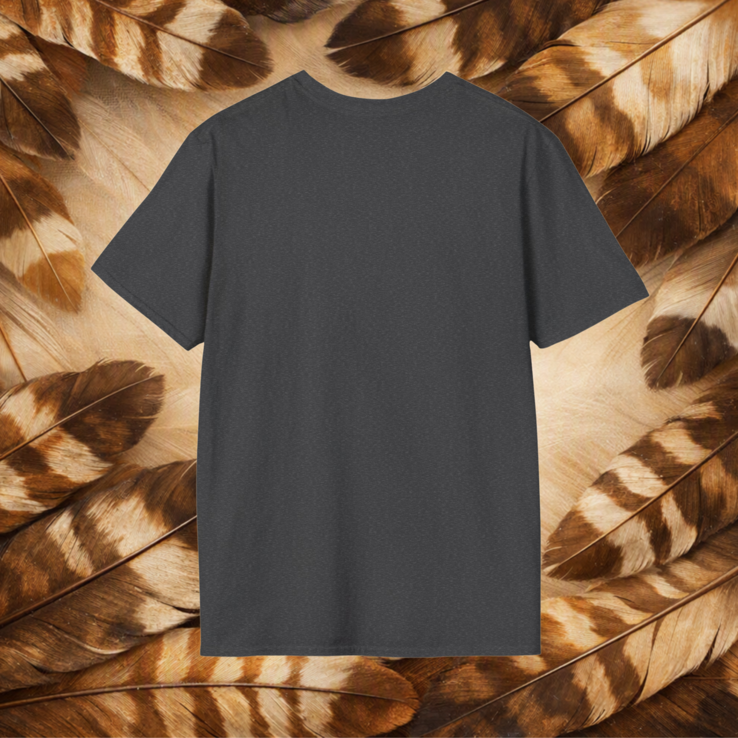 A dark charcoal gray short-sleeve t-shirt is centered against a background of brown and beige feathers.