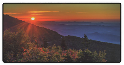 Extended desk mat with sunrise mountain landscape print and dark border