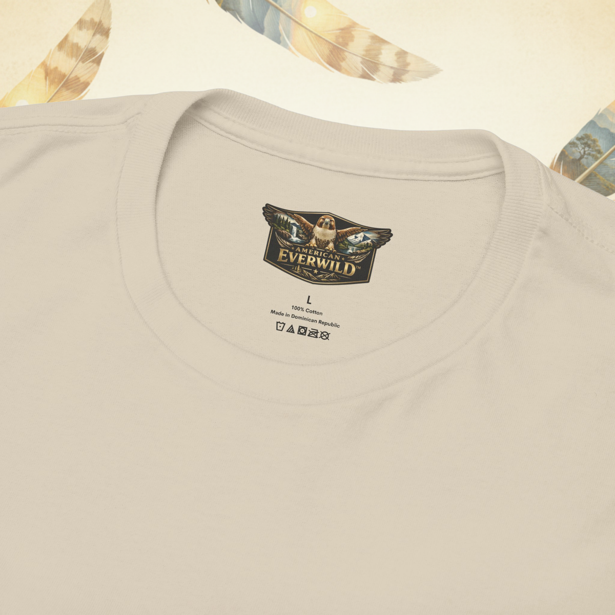 Close-up of asand colored crewneck t-shirt showing the inner neck label with the American Everwild brand logo.