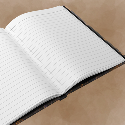 An open lined notebook with white pages and thin gray ruling, photographed at an angle on a warm beige textured background.